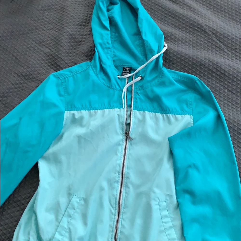 teal windbreaker